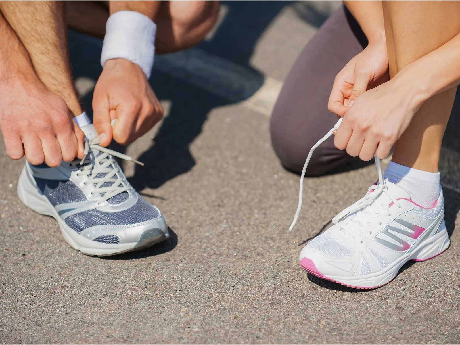 StepZone -StepZone Running shoes sneakers lace tying concrete sidewalk race GettyImages 493768733 g stockstudio cropped